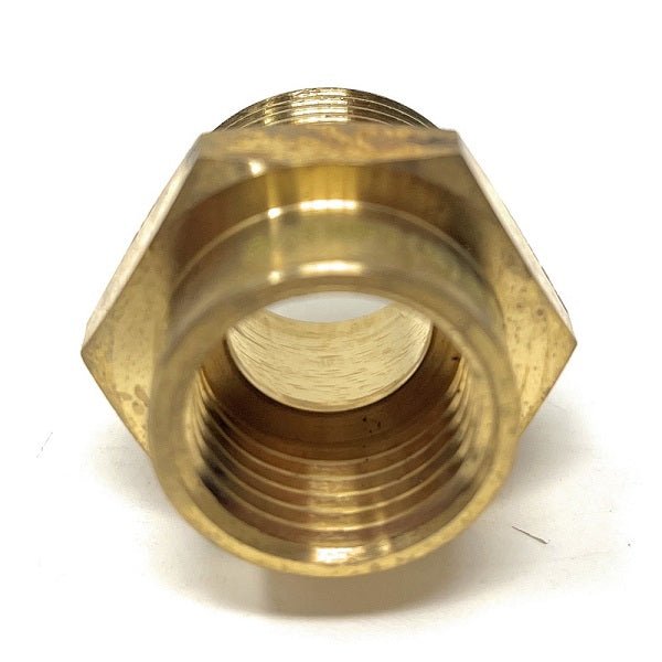 Brass hexagonal nut on a white background