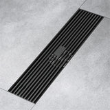 Matte black 12" linear shower drain with rectangular grille and stainless steel body
