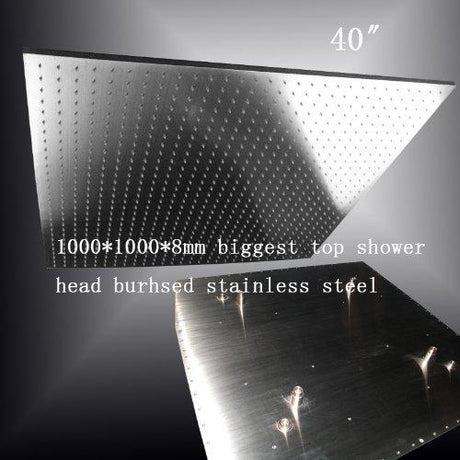Large ceiling mounted shower head rainfall water pattern