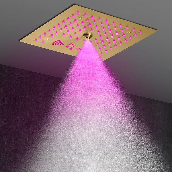 Cascada brushed gold shower head with amber LED lights illuminated
